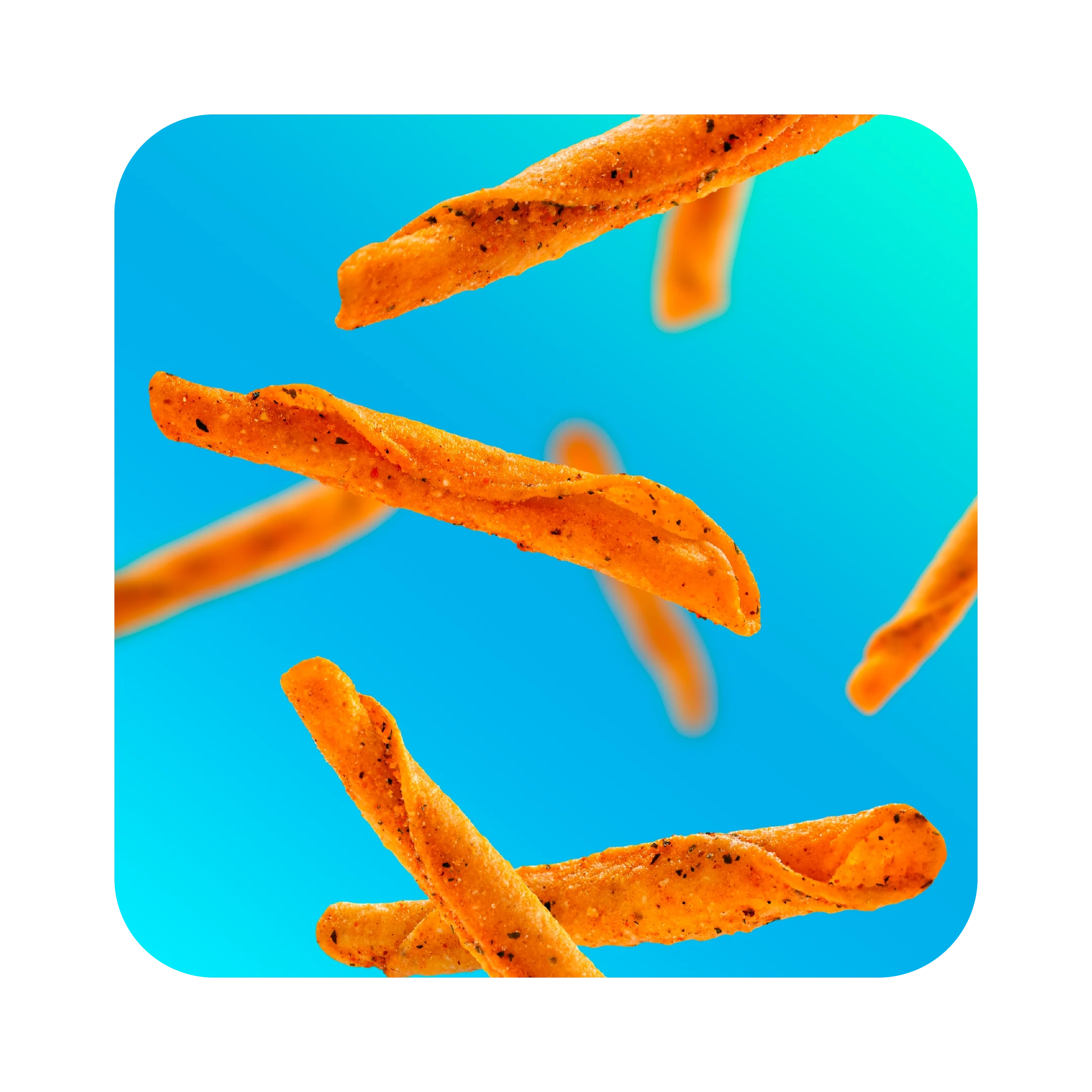 Orange rolled tortilla chips floating against a bright blue background